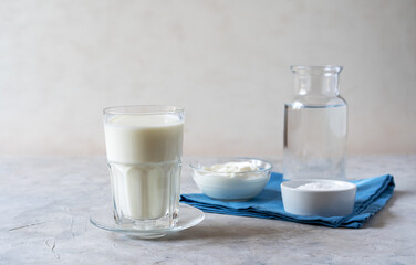 Ayran is a popular refreshing Middle Eastern beverage made with yogurt, water and salt. Concrete background