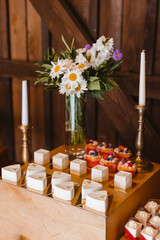 Candy bar. Festively decorated buffet table for guests. A stand with a variety of desserts for celebrating a party. Sweet buffet at a wedding party, birthday party.