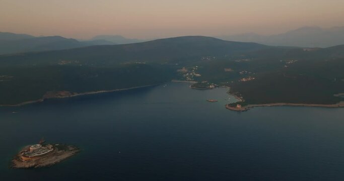 aerial view of mamula island , Otocic Gospa island and a bay during sunset