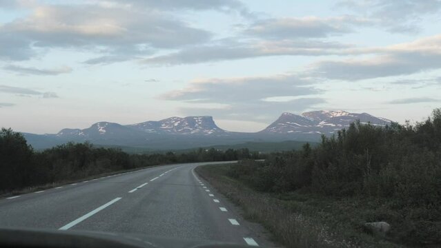 Front driving plate from Abisko, northern Sweden in the summertime. Mountain road in Lapland.