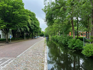 Fototapeta na wymiar Beautiful view of city street and canal