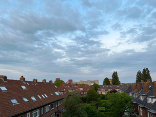 Picturesque view of city street with beautiful buildings on cloudy day