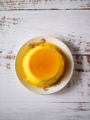 Spanish sweet flan on a white table