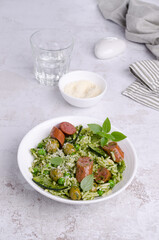 Pasta with vegetables and sausages