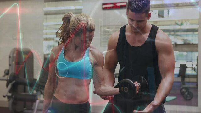 Animation of interface processing data over caucasian woman and male fitness trainer in gym