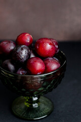 Plums on the dark background