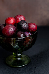 Plums on the dark background
