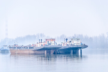 Anchored tankers during the winter period on the Danube River.