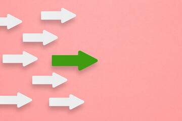 white arrows follow one green arrow paper cut. Symbol of following leader straight to the goal for business creativity new idea to discovering new business options, Individual and unique leader