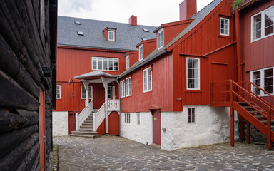 Faroe Islands, Denmark, 15.7.2022Old and beautiful architecture. Tinganes with old parliament buildings. Picturesque historical centre view with typical red painted grass roofed houses.