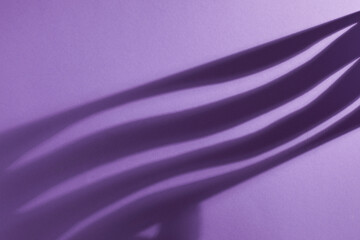 Light and shade top view on purple background.