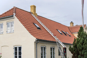 service ladder on roof of traditional house, Dragor, Denmark