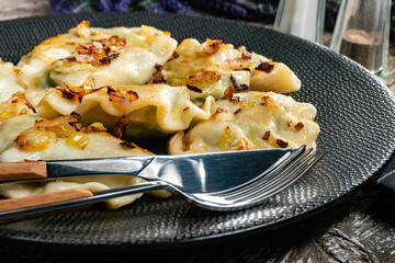 Fried dumplings (pierogi) with spinach.
