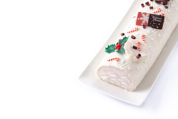 White chocolate yule log cake isolated on white background. Copy space