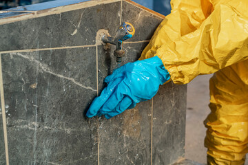 Shot of protective glove while washing at the fountain taken with selective focus.