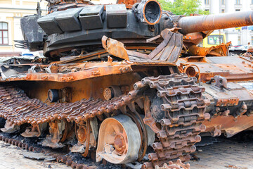 Destroyed rusty Russian tank on the city square.