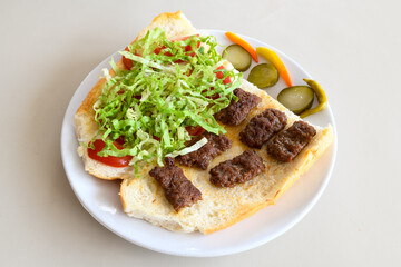 Meatball between bread (Turkish name : ekmek arasi kofte ) Izgara kofte. Manisa, Akcaabat, Akhisar  kofte