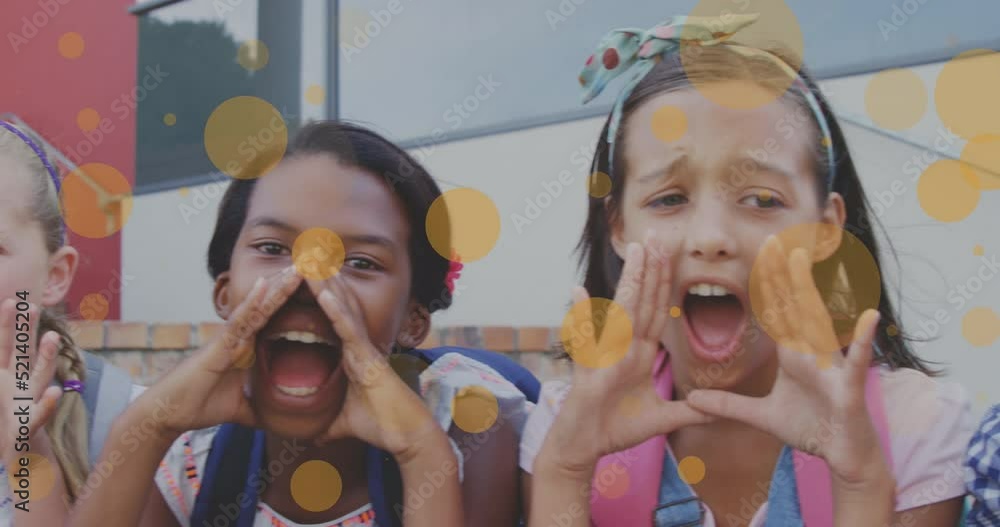 Sticker Animation of orange circles over happy diverse schoolchildren having fun shouting