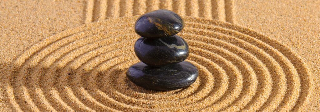 Japanese zen garden with stone in sand
