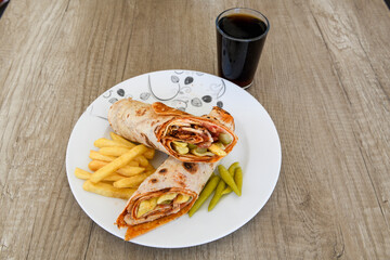 Lavash doner kebab ( zurna tavuk et doner durum )  or shawarma sliced in plate isolated. 