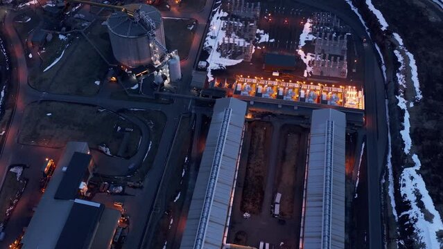 Dark evening at aluminium smelter industrial facility, modern factory, aerial