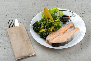 Salmon teriyaki with and vegetable in bowl.