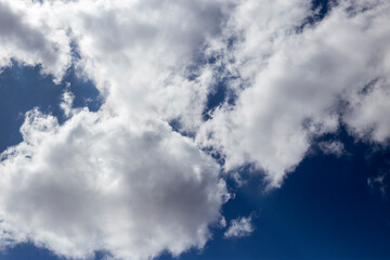 BLUE SKIES WITH PARTIAL CLOUDS