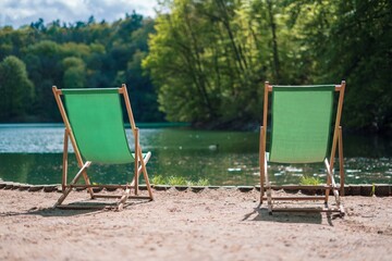 beach chairs by the lake in in the forest