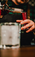 man bartender hand making cocktail in bar
