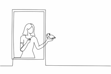 Single continuous line drawing young woman standing on windowsill with bird in arm. Happy female on balcony with her pet. Open window to get fresh air. One line draw graphic design vector illustration