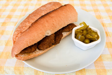 Grilled chili, tomato and sucuk between bread. ( Sucuk ekmek ) 