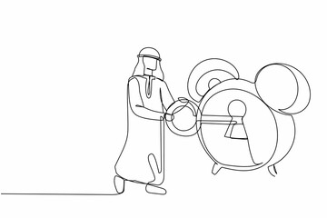 Single continuous line drawing Arabian businessman putting big key into alarm clock. Deadline work concept and on going project to finish. Time management. One line graphic design vector illustration