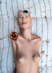 Old abandoned broken sad mannequin. Post-apocalyptic future. Old abandoned building. Hopelessness and despondency, forgetfulness. Old vintage photo.