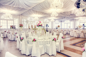 Before the wedding banquet. A large hall in the restaurant, prepared for a wedding dinner