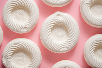 Empty meringue nests placed on a pink background