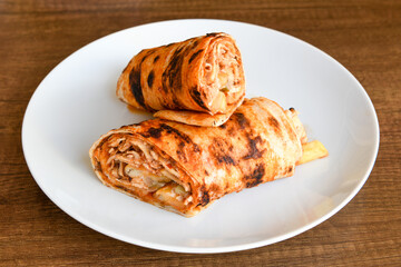Lavash doner kebab ( doner zurna durum )  or shawarma sliced in plate isolated. 