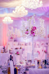 Flower arrangement at a wedding banquet in a restaurant in neon colors