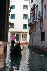 Fototapeta na wymiar Gondolers in Venice Canals Italy Beautiful old architecture reflections high resolution 