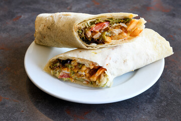 Lavash doner kebab ( doner zurna durum )  or shawarma sliced in plate isolated. 