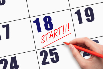 18th day of the month. Hand writing text START and drawing a line on calendar date.