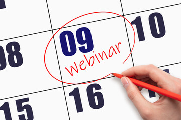 9th day of the month.  Hand writing text WEBINAR and circling the calendar date.