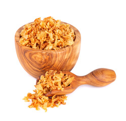 Roasted onions in wooden bowl and spoon, isolated on white background. Crispy fried onions.