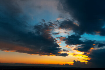 Fototapeta na wymiar Beautiful landscape of sunset with dark colourful clouds. Natural background.