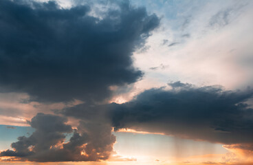 Fototapeta na wymiar Beautiful landscape of sunset with dark colourful clouds. Natural background.