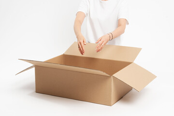 Woman preparing online shopping parcel for shipping. Online shopping concept.