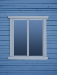 Close up the modern window frame against the background of blue wooden wall.