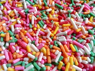 Colorful and chocolate candy sprinkles. Nonpareils, rainbow sprinkle