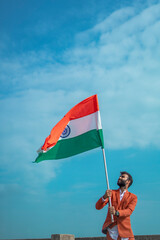  indian young man holding tricolour flag, independence day