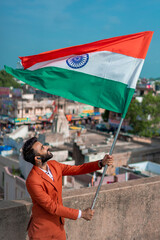  indian young man holding tricolour flag, independence day