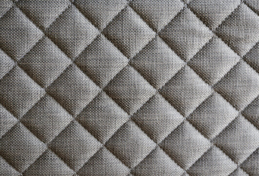Close up shot of white orthopedic mattress top side surface pattern with a lot of copy space for text. Hypoallergenic foam matress for proper spinal alignment and pressure point relief. Background © Evrymmnt